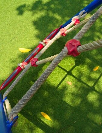 Playground ropes and turf surface with mulch