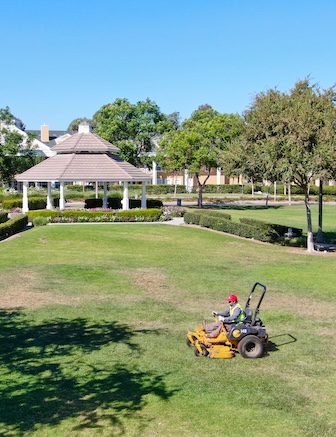 Aerial view of lawn care riding mower at the square park, Ladera Ranch. california.