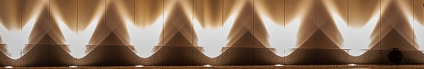 Dramatic spotlighting on exterior wall