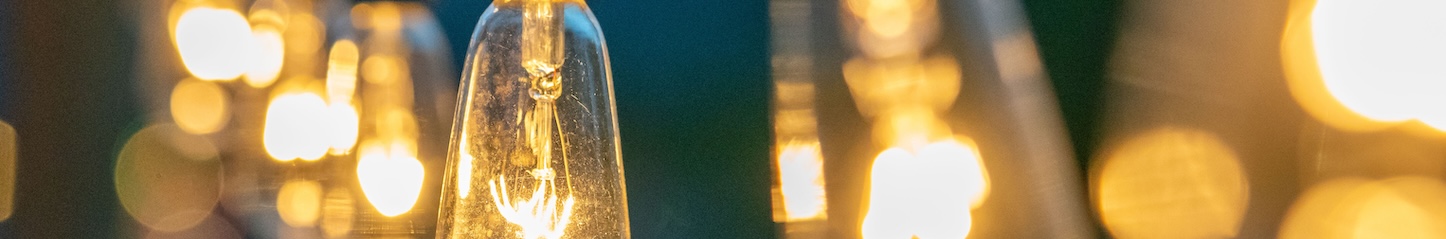 Close-up of warm pendant lighting in outdoor space