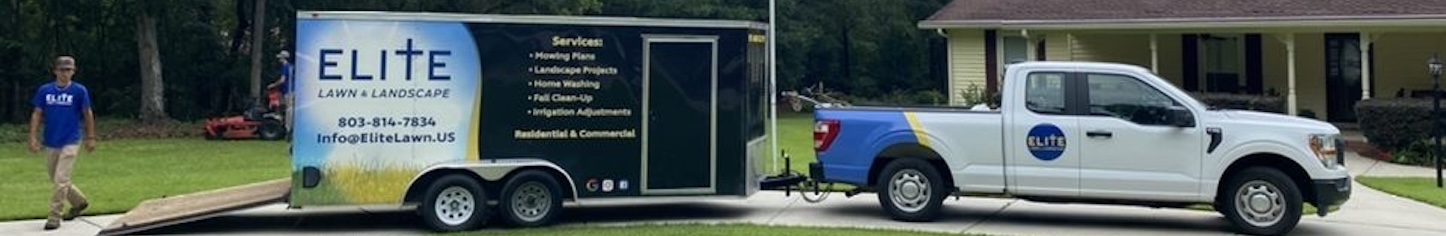 Elite Lawn & Landscape trailer parked on driveway