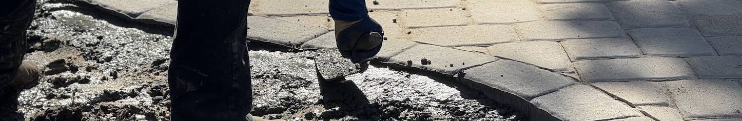 Concrete being smoothed during patio construction