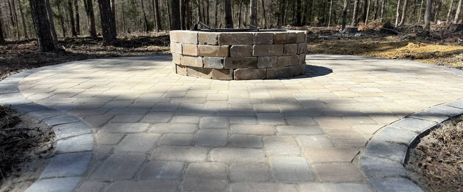 Stone fire pit on paver patio