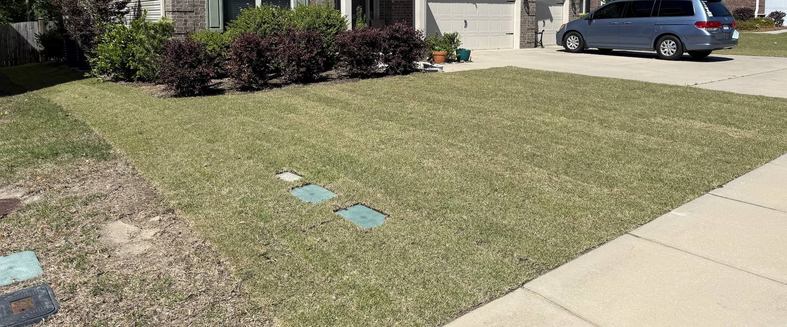 Lawn with stepping stones leading to front porch