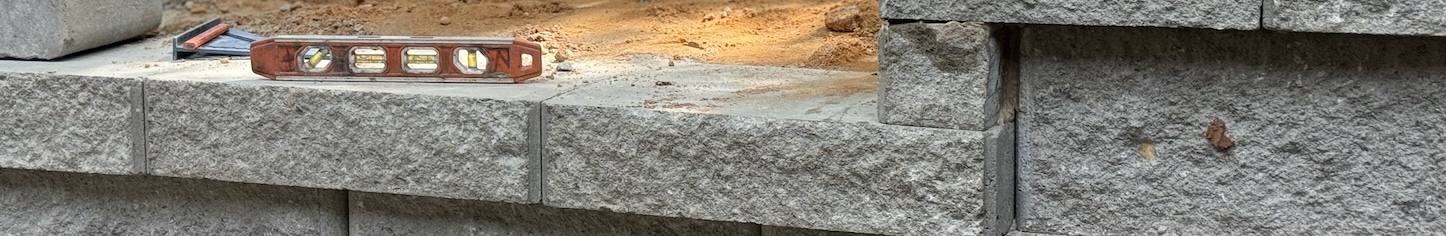 Concrete retaining wall block during install