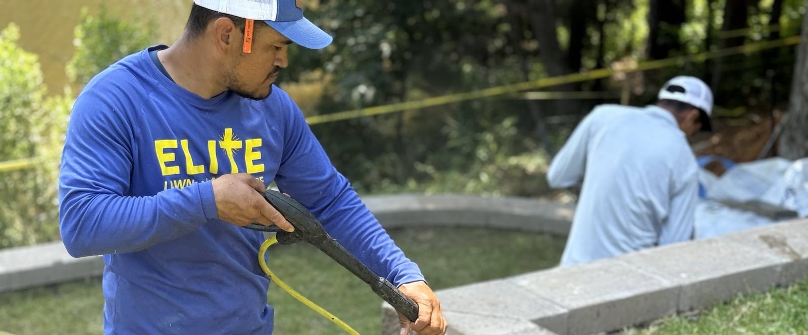 Team member measuring for outdoor installation